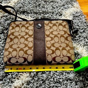 Brown Crossbody coach bag, perfect size for to carry a small tablet.